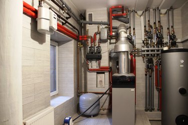Boiler, water heater, expansion tank and other pipes. Autonomous heating system in the boiler room.