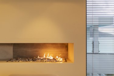 Modern rock gas fireplace in home showcase interior