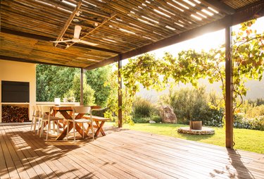 Table and chairs on a rustic patio on a sunny afternoon