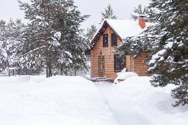 Log house in winter.