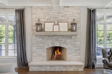 Stone fireplace with wood mantel