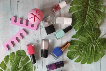 Nail polish and manicure kit on table.