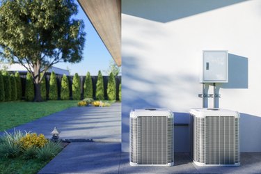 Closeup View Of Air Conditioning Outdoor Units In Backyard