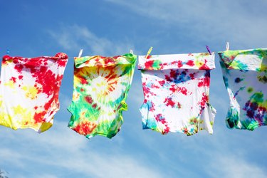 Tie-dyed T-shirts on clothesline.
