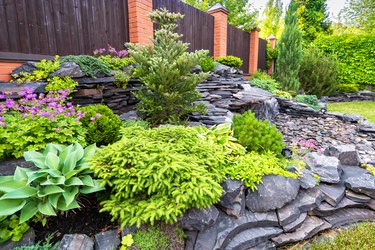 Natural stone landscaping in backyard in summer