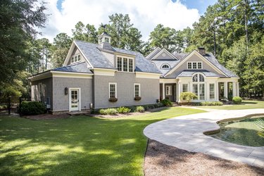 Front view of large cape cod style home with custom feautures