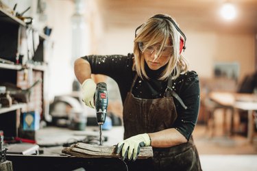 Woman using an orbital sander.