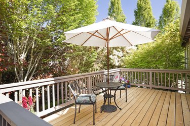 Sunny second floor back deck with breakfast table