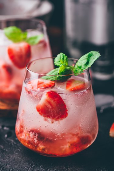 Cocktails with strawberry, gin, and tonic