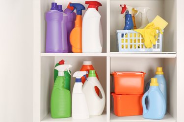 Cleaning supplies on shelves.