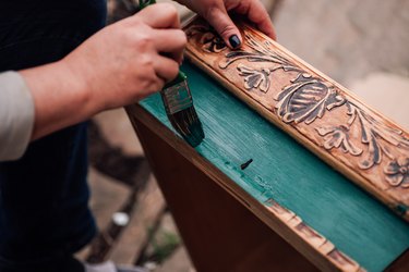 Painting old wooden furniture.