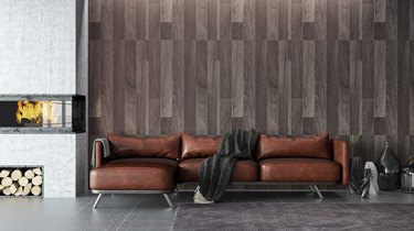 Leather Sofa With Wooden Wall And Fireplace