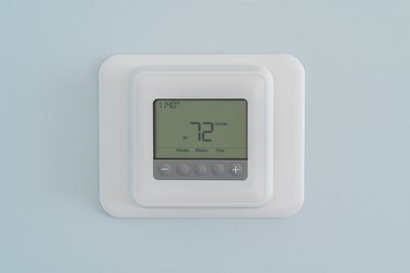 Modern residential programmable heating and cooling thermostat
