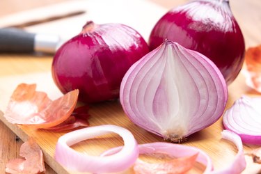 Whole and sliced red onions.