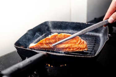 Chef Hand Pan Seared Salmon Fillet At home