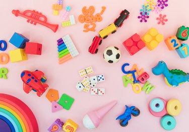 Background with different wooden and plastic kids toys with copy space