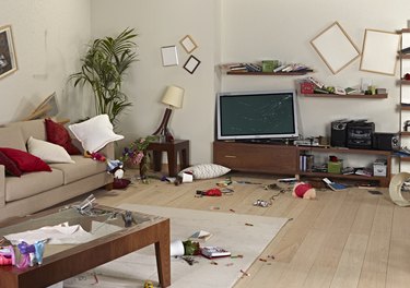 messy living room with damage