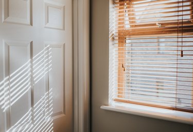 Natural Wooden window and White door frame with sunbeams shining in