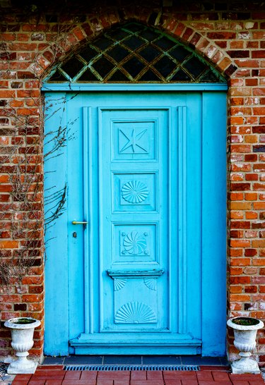 Blue house door of old brick house