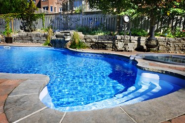 Swimming pool accented with a waterfall