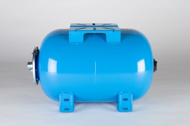Blue horizontal pressure tank on a grey background.