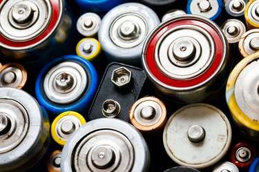 Used Alkaline batteries toxic waste recycling and ecology issues concept