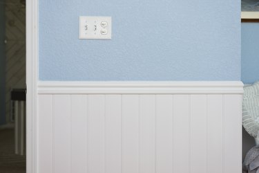 White beadboard or wainscoting with light blue wall paint