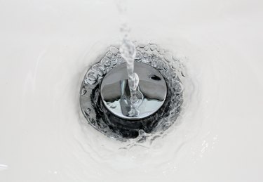 Draining water from a sink that foams in from a new clean bathroom