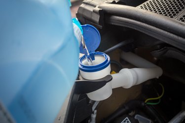 adding winter windscreen washer fluid in the car