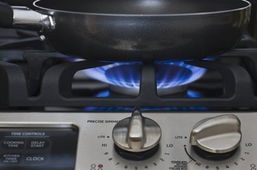 Closeup of skillet on gas stove.