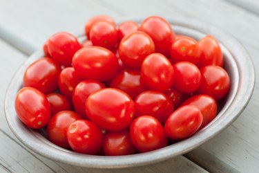 Small heirloom tomatoes in ceramic bowl