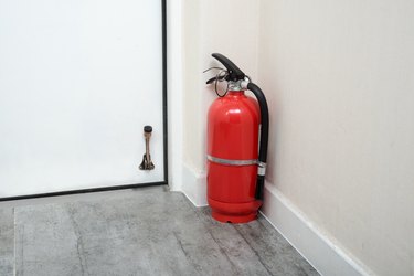 Fire extinguishers in home door.