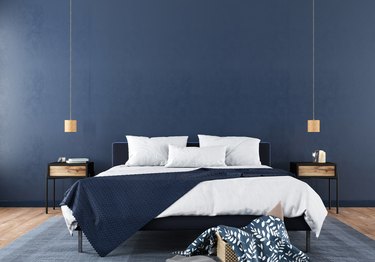 Stylish bedroom interior in trendy blue.