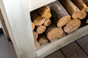 View of Fire Wood stocked inside Furniture shelf