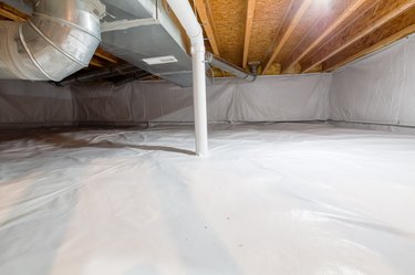Crawl space fully encapsulated with thermoregulatory blankets.