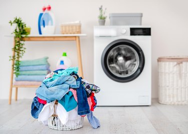 Heap of clothes for washing in basket