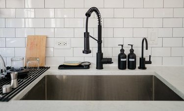 kitchen sink with white subway tiles