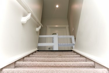 Baby gate at top of stairs