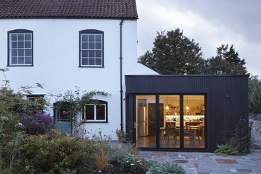 Modern extension built onto the side of a listed period property.