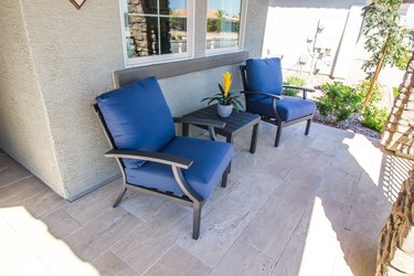 Front Porch With Table & Two Cushioned Chairs