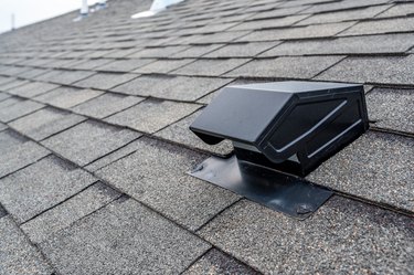 Static vent installed on a shingle roof for passive attic ventilation