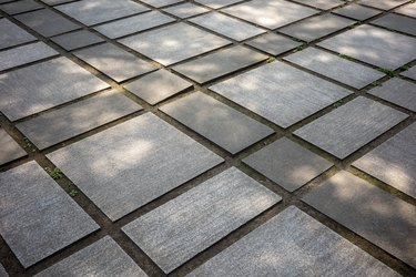 The sun shines on the paved square