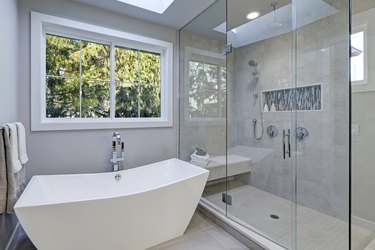 Glass walk-in shower in bathroom of new luxury home.