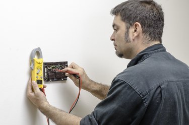 Technician working on thermostat