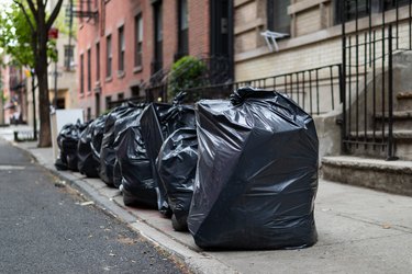 Black Garbage Bags along a Residential Street in Greenwich Village of New York City