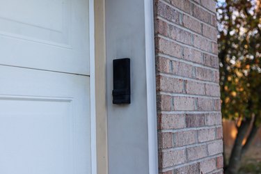 A garage door opener keypad on a residential home