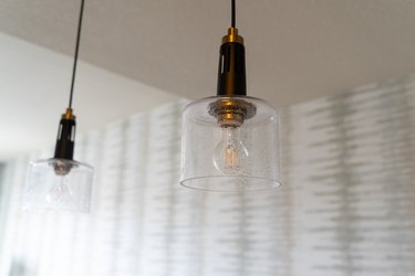 Glass light fixtures featuring exposed lightbulbs.