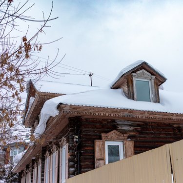 Wooden houses under the snow
