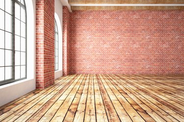 Empty Room With Brick Wall And Wood Floor