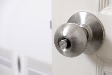 Stainless steel push-button doorknob.